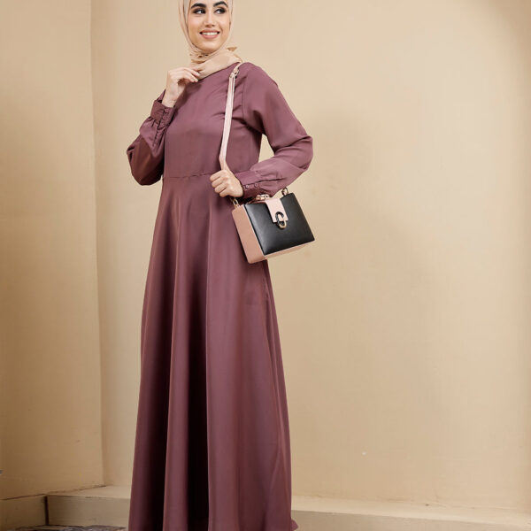 Front view of dusty peach flared maxi dress – modest abaya design